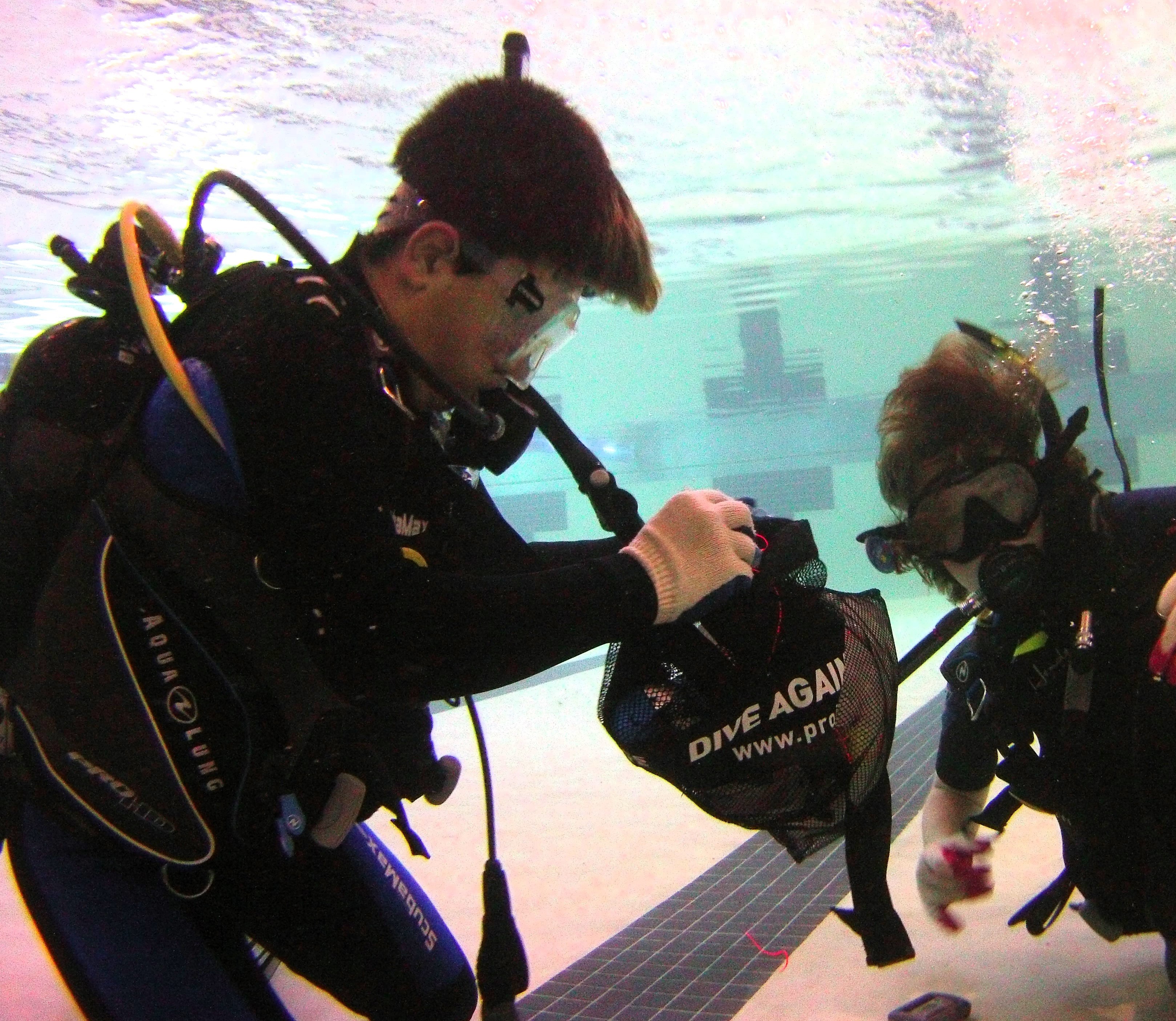 Ocean Guardians Dive Club divers picking up debris